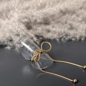 Bague nœud long doré