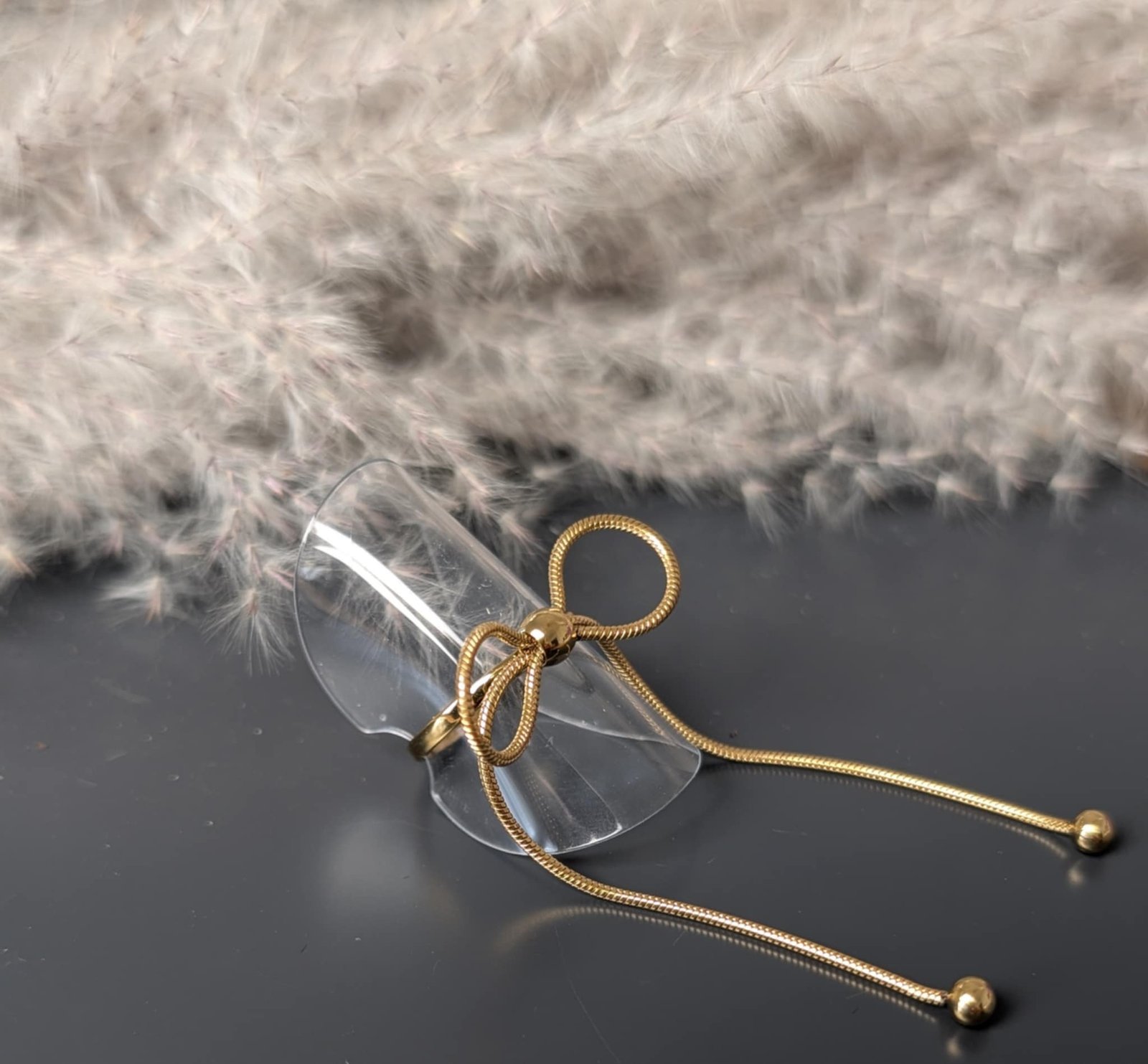 Bague nœud long doré