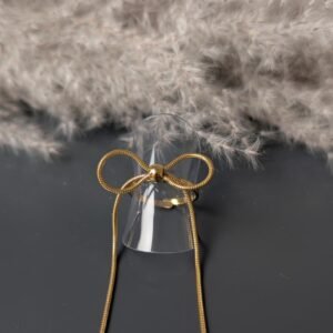 Bague nœud long doré