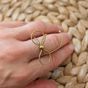 Bague nœud long doré